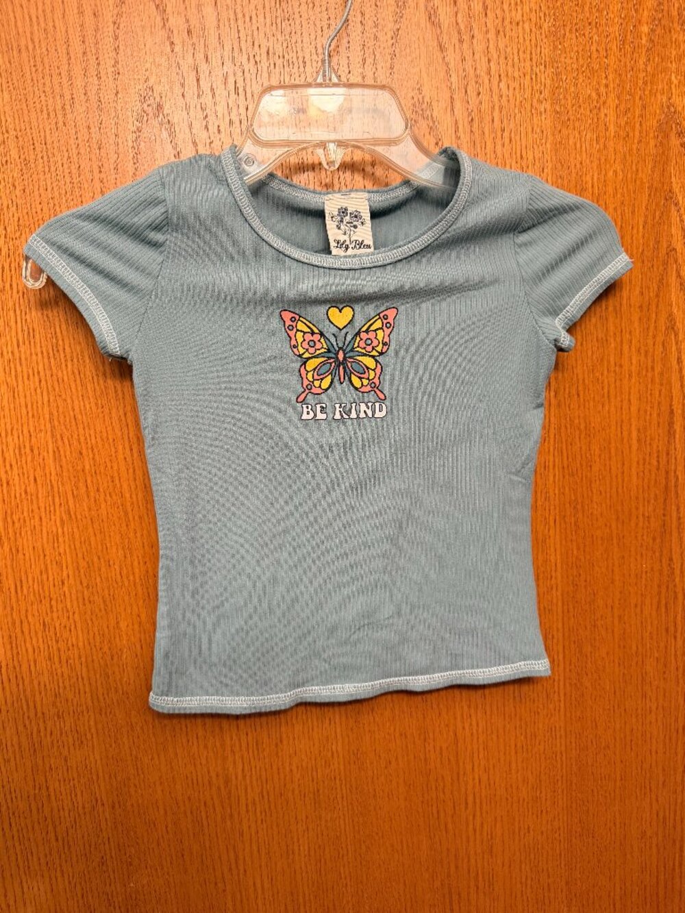 Green "Be kind" shirt